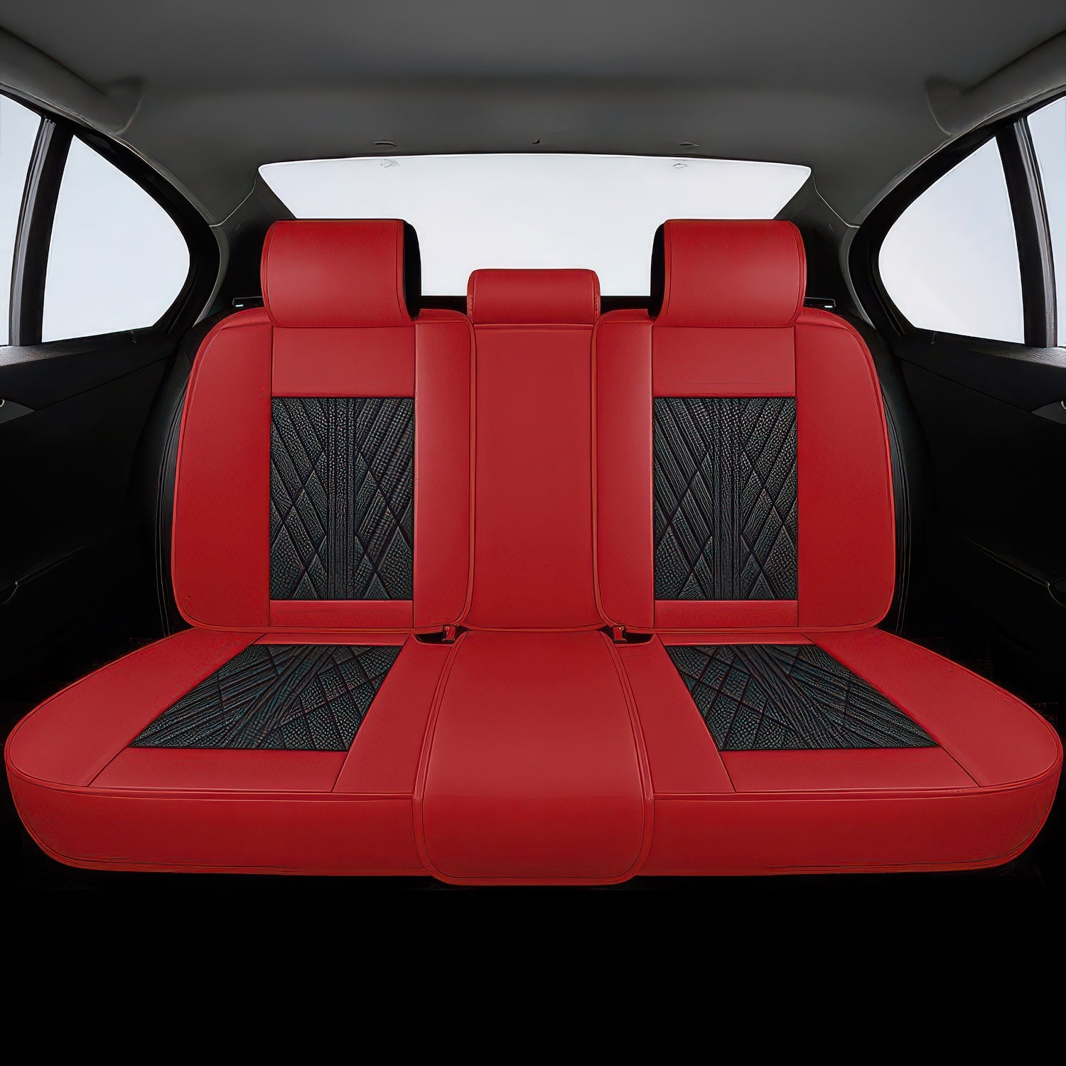 Red car seat covers with black diamond pattern on a black car interior