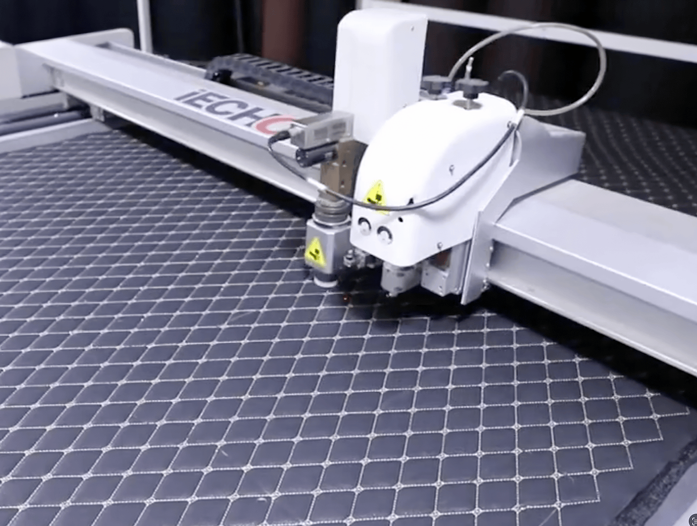 CNC machine in operation on Ultra Car Mats