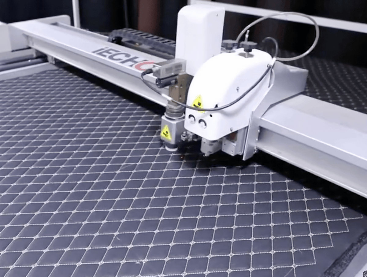 CNC machine in operation on Ultra Car Mats
